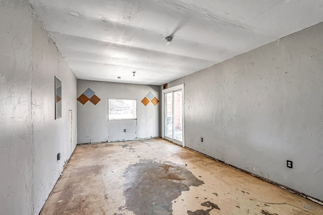 2109 Holloway Ave, Midland, TX 79705 - spare room featuring unfinished concrete floors