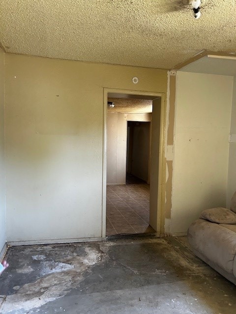 spare room with a textured ceiling