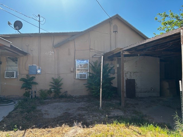 view of property exterior with a carport