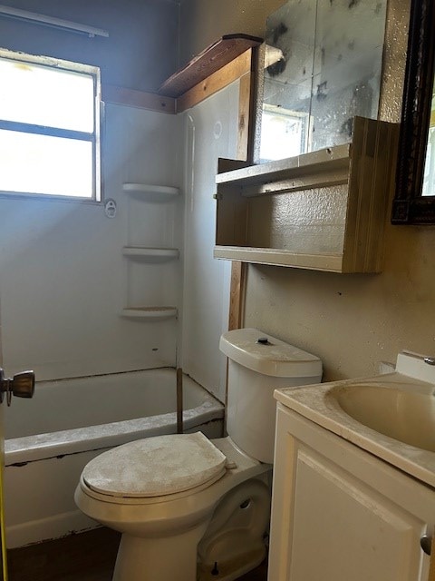 full bathroom with shower / tub combination, vanity, and toilet