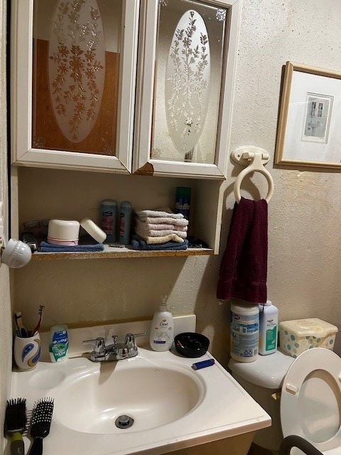 bathroom featuring sink and toilet