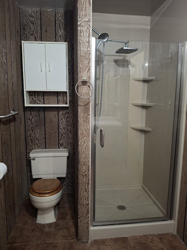 full bath with a stall shower and toilet