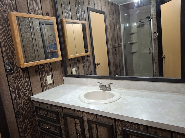 bathroom with a shower and vanity