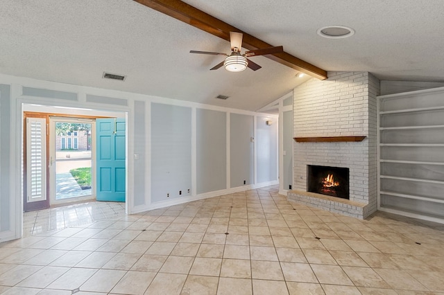 3400 Dentcrest Dr, Midland, TX 79707 - unfurnished living room featuring a textured ceiling, a ceiling fan, a brick fireplace, light tile patterned floors, and built in shelves
