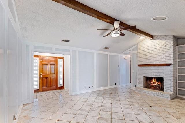 3400 Dentcrest Dr, Midland, TX 79707 - unfurnished living room with a textured ceiling, a ceiling fan, a brick fireplace, and light tile patterned floors