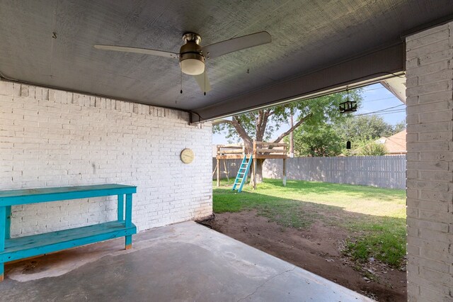 3400 Dentcrest Dr, Midland, TX 79707 - fenced backyard featuring ceiling fan, a playground, and a patio area