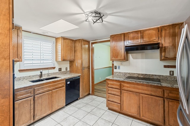3400 Dentcrest Dr, Midland, TX 79707 - kitchen featuring black appliances, range hood, light tile patterned flooring, and brown cabinets