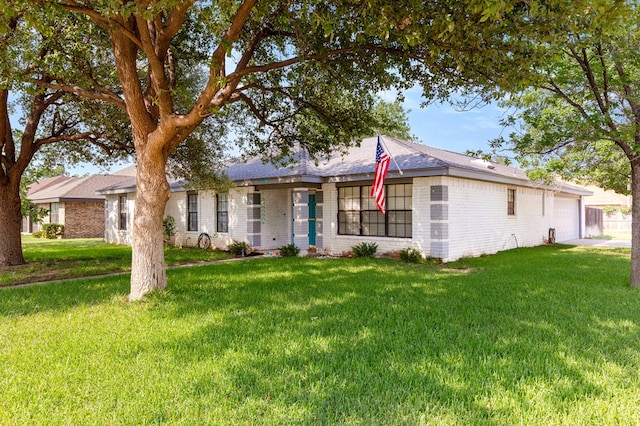 3400 Dentcrest Dr, Midland, TX 79707 - ranch-style house with brick siding, a front lawn, and an attached garage