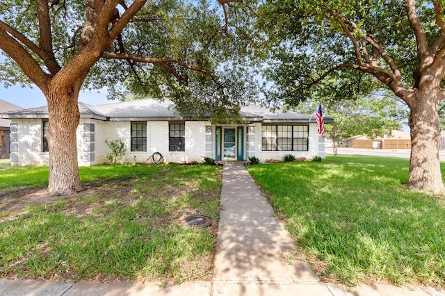 3400 Dentcrest Dr, Midland, TX 79707 - ranch-style home featuring a front yard and brick siding