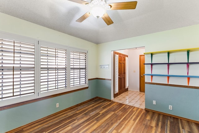 3400 Dentcrest Dr, Midland, TX 79707 - spare room featuring wood finished floors and a ceiling fan
