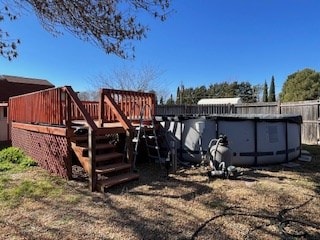 view of jungle gym featuring a fenced in pool