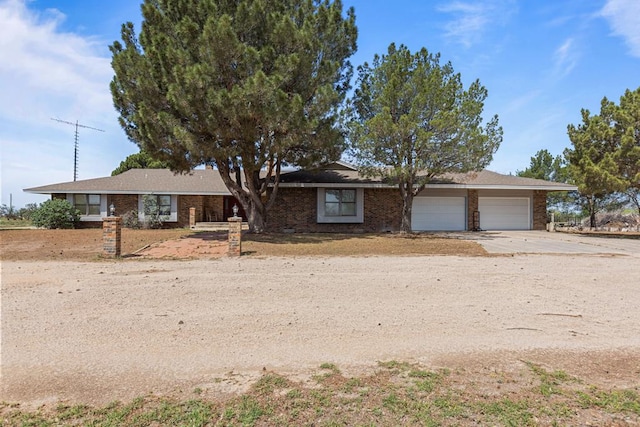 single story home featuring a garage