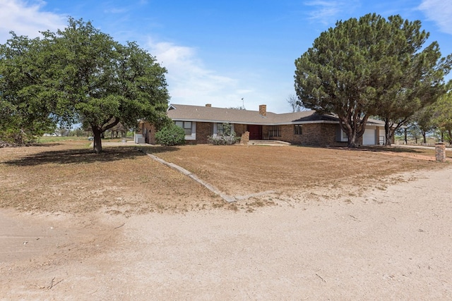 single story home featuring a garage