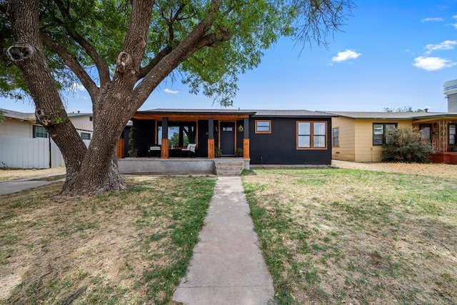 single story home featuring a front yard