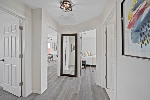 bedroom featuring ceiling fan and light hardwood / wood-style flooring