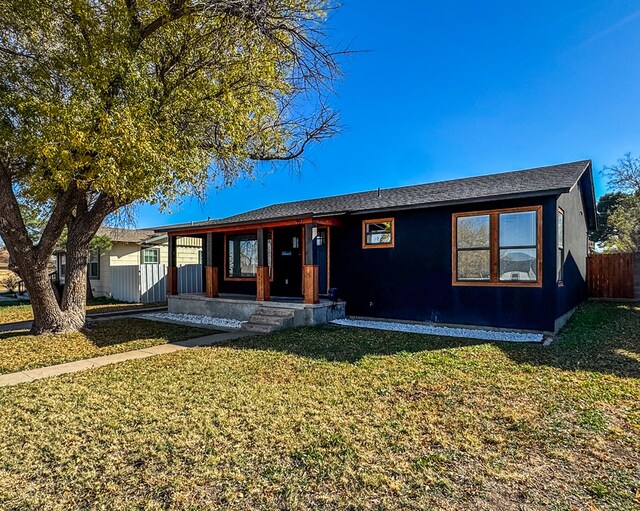 ranch-style house featuring a front lawn