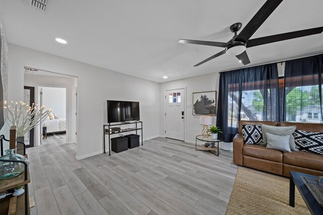 spare room featuring a barn door and light hardwood / wood-style flooring