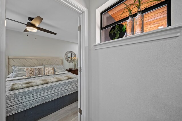 washroom with ceiling fan, cabinets, light tile patterned floors, and washing machine and dryer