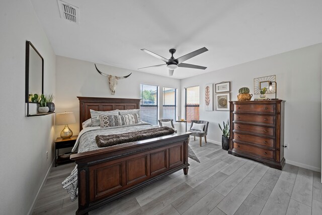 unfurnished bedroom with ceiling fan, a closet, and light hardwood / wood-style floors