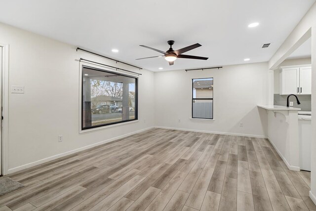 bedroom with hardwood / wood-style floors and ceiling fan