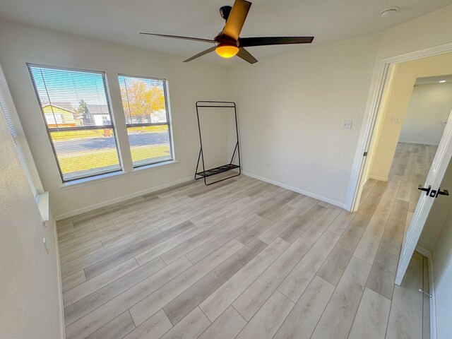 bedroom with light wood-type flooring and ceiling fan