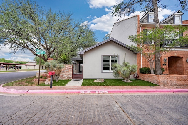 1 Lafayette Pl, Midland, TX 79705 - view of front of property with stucco siding and a front lawn