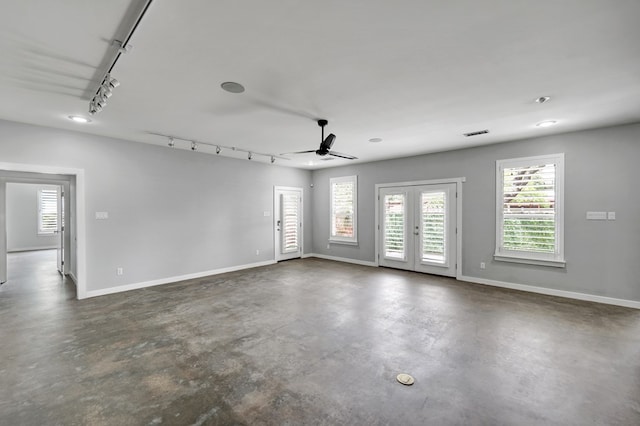 1 Lafayette Pl, Midland, TX 79705 - spare room with finished concrete flooring, a ceiling fan, track lighting, and french doors