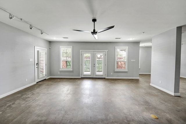 1 Lafayette Pl, Midland, TX 79705 - empty room featuring concrete floors, a ceiling fan, french doors, and rail lighting