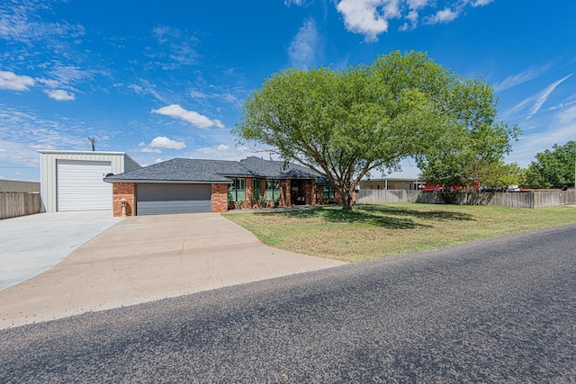 2108 S County Rd 1086, Midland, TX 79706 - view of front of home featuring brick siding, concrete driveway, and a garage