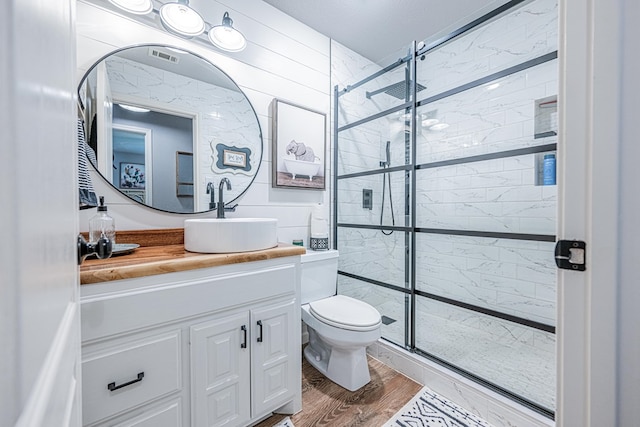 2108 S County Rd 1086, Midland, TX 79706 - bathroom with vanity, tiled shower, and wood finished floors
