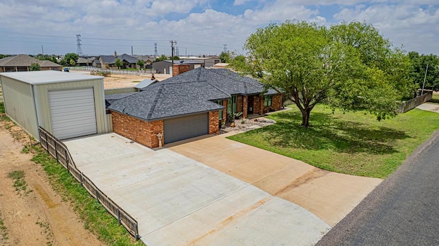 2108 S County Rd 1086, Midland, TX 79706 - single story home with brick siding, roof with shingles, and driveway