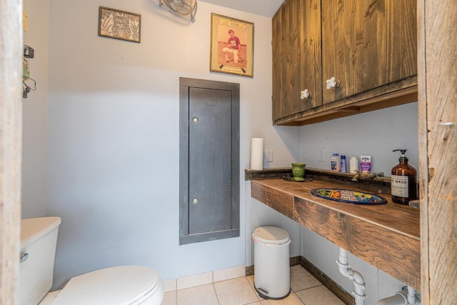 2108 S County Rd 1086, Midland, TX 79706 - half bathroom with toilet and tile patterned floors