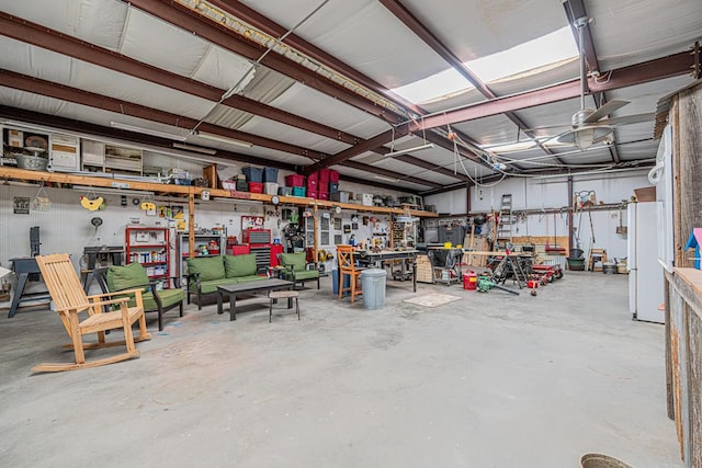 2108 S County Rd 1086, Midland, TX 79706 - garage with a workshop area and freestanding refrigerator