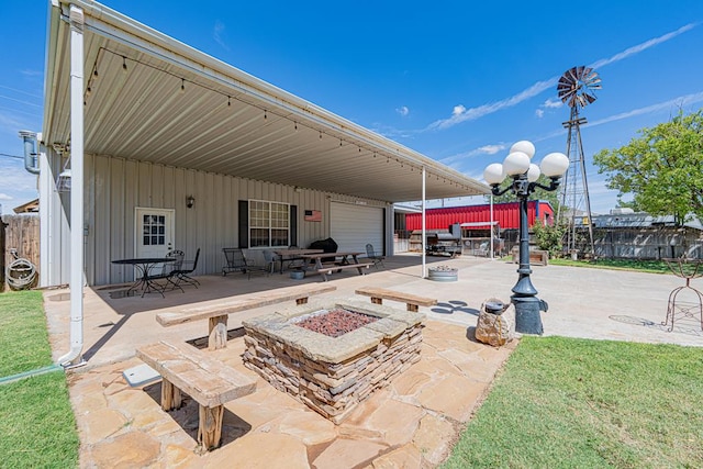 2108 S County Rd 1086, Midland, TX 79706 - view of patio with an outdoor fire pit and a garage