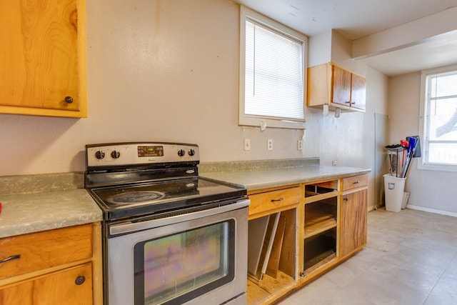 kitchen featuring electric stove and light countertops