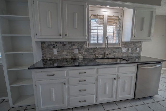 kitchen featuring a sink, open shelves, dishwasher, light tile patterned floors, and white cabinetry