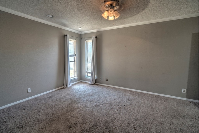spare room with a textured ceiling, ornamental molding, a ceiling fan, carpet flooring, and baseboards