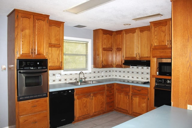 kitchen with a textured ceiling, sink, backsplash, and black appliances