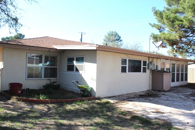 view of side of home featuring a sunroom