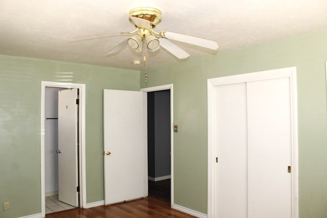 unfurnished bedroom featuring a closet, ceiling fan, and hardwood / wood-style floors