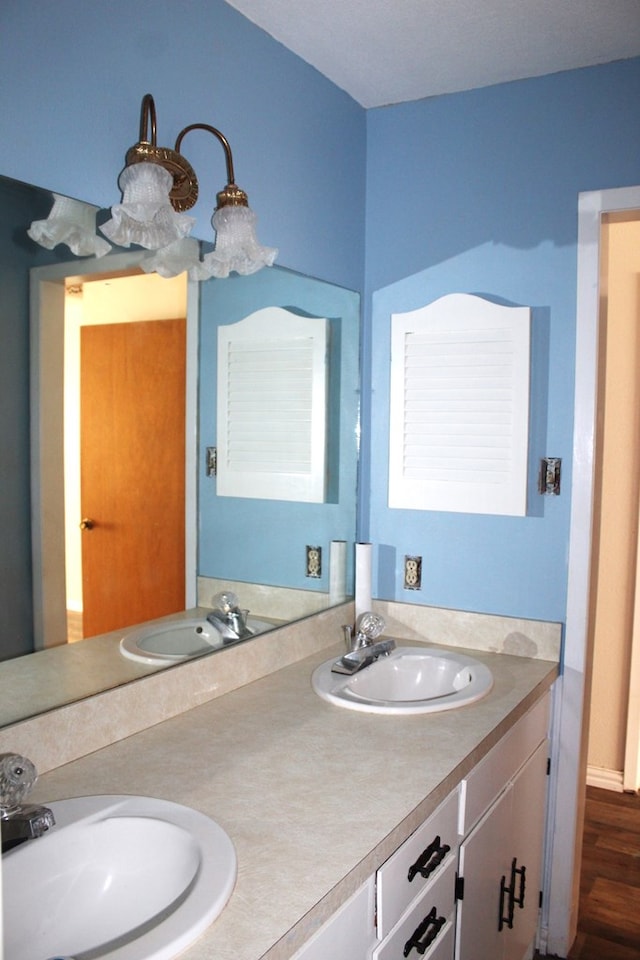 bathroom featuring hardwood / wood-style floors and vanity