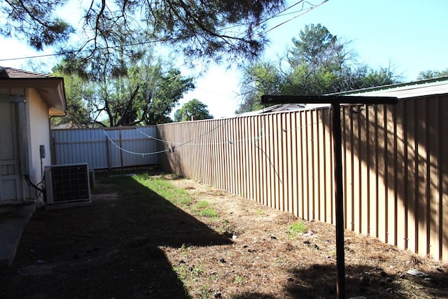 view of yard with central AC