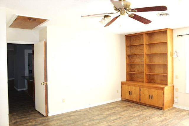 empty room featuring ceiling fan and light hardwood / wood-style floors