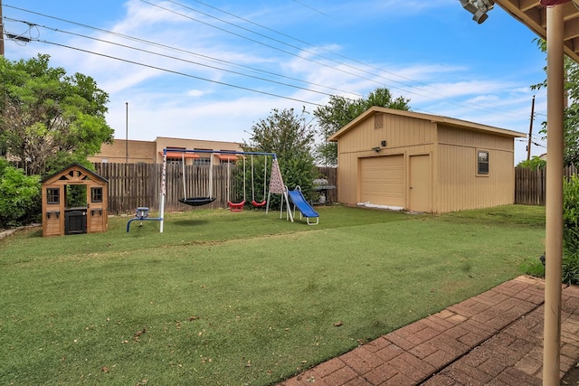 2108 Cecilia, Big Spring, TX 79720 - fenced backyard with a playground, a garage, and an outbuilding