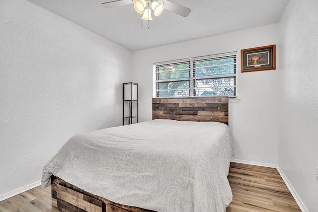 2108 Cecilia, Big Spring, TX 79720 - bedroom featuring light wood-type flooring and a ceiling fan