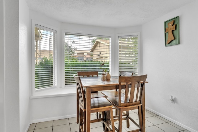 2108 Cecilia, Big Spring, TX 79720 - dining room with light tile patterned flooring and a textured ceiling