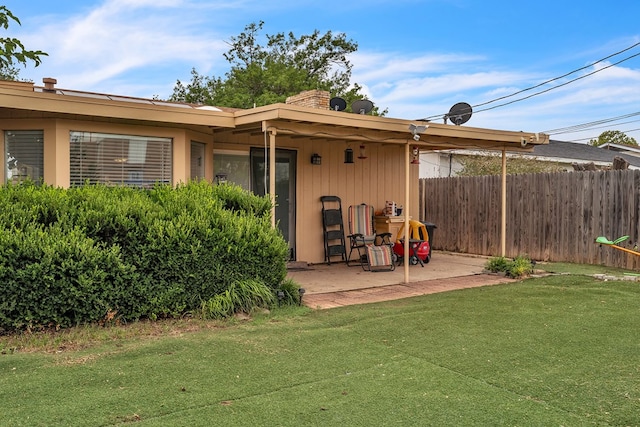 2108 Cecilia, Big Spring, TX 79720 - back of house with a patio area and a chimney