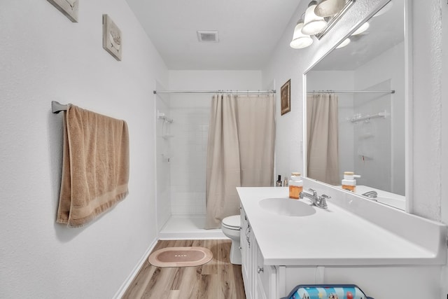 2108 Cecilia, Big Spring, TX 79720 - bathroom with wood finished floors, tiled shower, and vanity