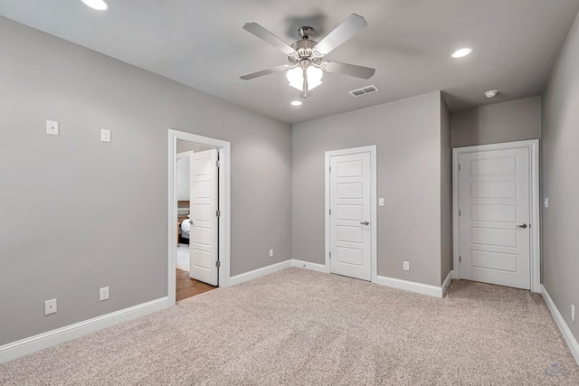 unfurnished bedroom featuring ceiling fan and carpet floors