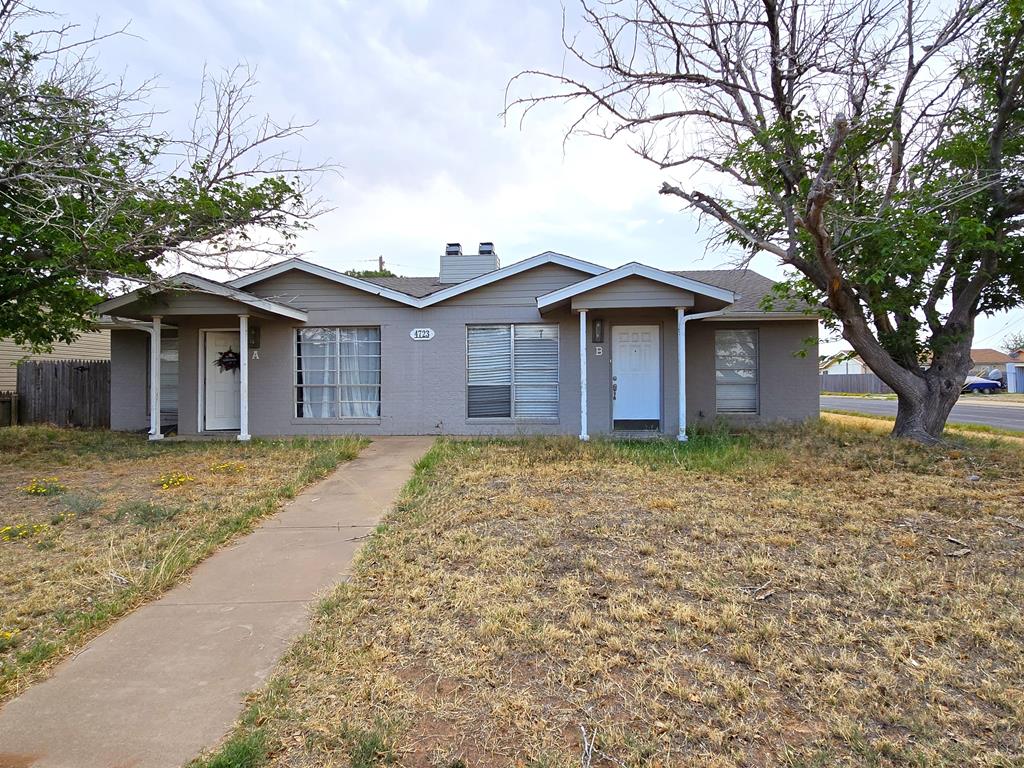 4723 Harvard Ave, Midland, TX 79703 - view of front facade featuring brick siding and a chimney